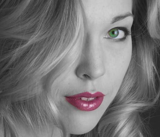 B+W photo of woman with eye and lips in colour